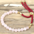Pulsera de hilo burdeo con Cuarzo Rosa