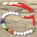 Pulsera de hilo rojo con Khaulita blanca - Chakras