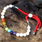 Pulsera de hilo rojo con Khaulita blanca - Chakras